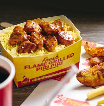 A range of Pepes Piri Piri chicken, sides, drink and dip